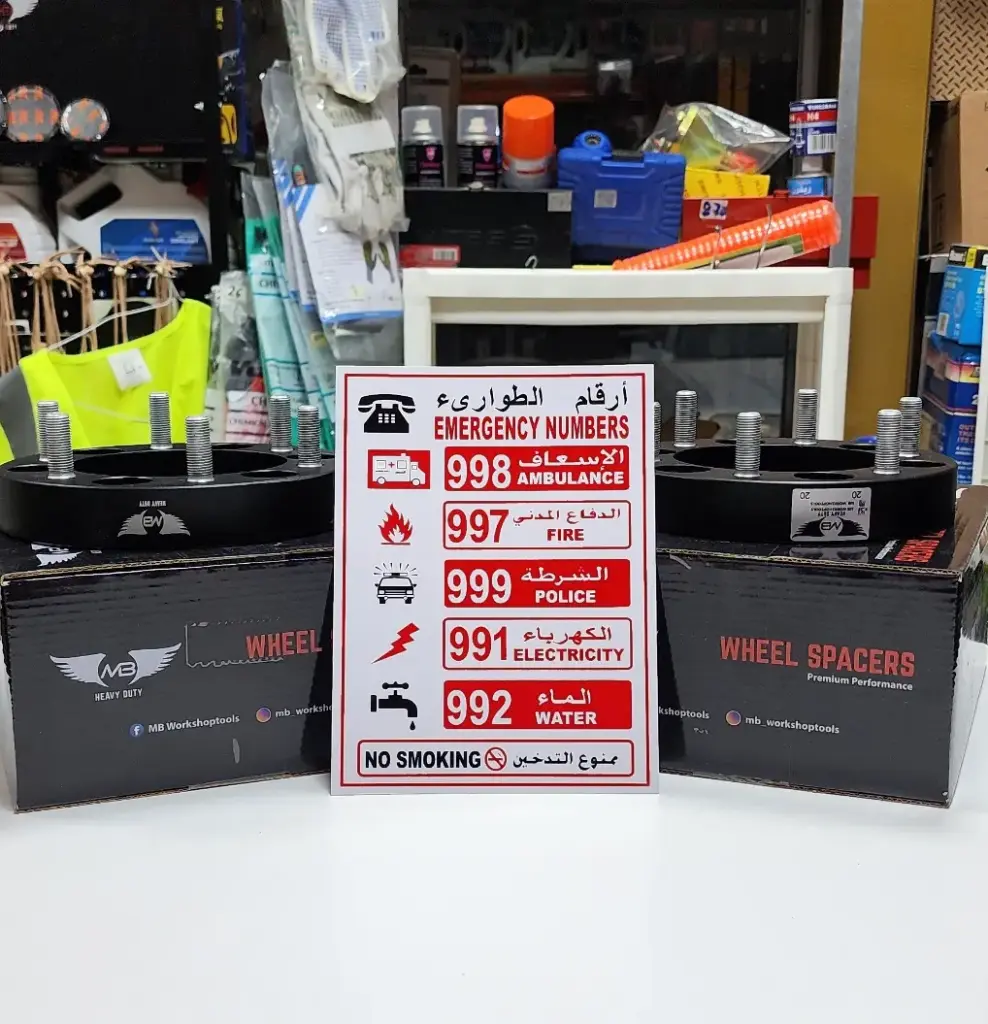 small white sticker with emergency contact numbers